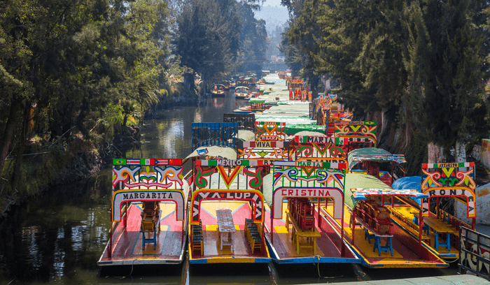 PUR_BLOG_07.25_CANVA_Trajinera Boats in Xochimilco